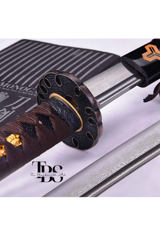 Handcrafted Damascus Steel Katana Sword with Brown Handle, Black Blade Cover with Golden Detailing, and Bronze Accents Below Handle – Perfect for Anniversary, Groomsmen Gifts, Christmas Gifts, and Collectors - TheBlacksmithLtd #